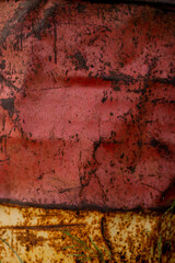 Old rusty barrel with peeling paint, texture