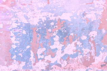 Background pink and light blue spots on cracked stucco.
