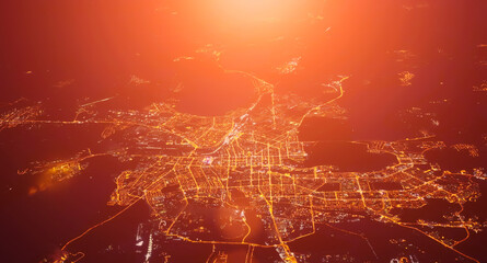 Beautiful sunset over the city. View from airplane