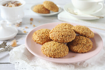 Sesame cookies and cup of tea for sweet breakfast