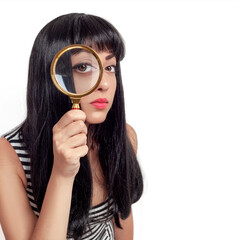 female looking at the camera through a magnifying glass, isolated on white background