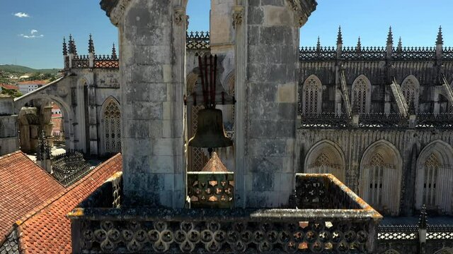 Aerial upward view of Bell Tower. Batalha Monastery in Portugal. Dominican convent with manueline style and Medieval architecture.