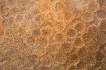 Texture of old forged bronze top view as background