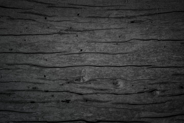 Grunge dark wood texture background. Vintage black wooden board wall antique cracking old style background objects for furniture design. Painted weathered peeling table wood hardwood decoration.