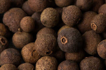 Allspice, as background texture close-up. Macro