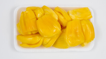 Ripe jack fruit slices against white background