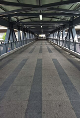 Architecture construction of elevator, escalator stairs and sky walk way, walk bridge between sky train station and department store mall