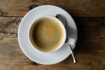 Portrait of coffee against old wooden table