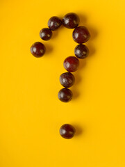 Portrait of question mark made of grapes
