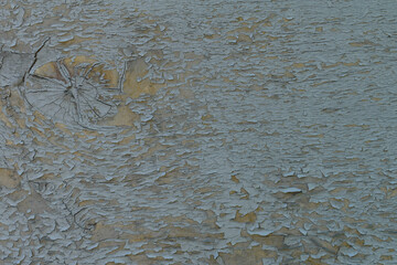Wooden background with peeling blue paint