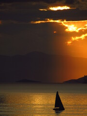 A beautiful sunset by the sea under a cloudy sky 