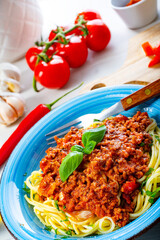 Delicious spaghetti bolognese on white background