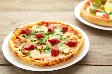 Delicious italian pizzas on grey wooden table