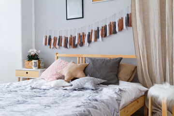 Cozy bed in the bedroom