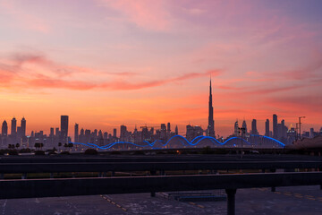 Beautiful sunset in Dubai. Night city scyline. Modern futuristic city lights. 