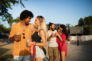 Group of happy friends people having fun together outdoors