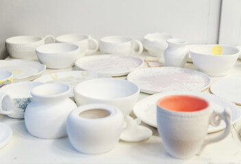 Stoneware dishes in a ceramics artists home pottery studio.