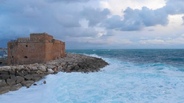Aerial drone view of Pathos Castle on Mediterranean seashore in Cyprus island.
