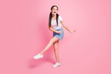 Obraz na płótnie Canvas Full length body size view of her she nice attractive lovely charming pretty feminine glad cheerful cheery girl having fun time isolated over pink pastel color background