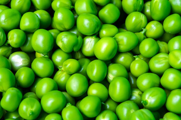 background of fresh, young, peeled green peas