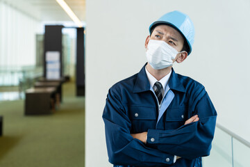 Fototapeta na wymiar マスクを着用した作業員　感染症対策