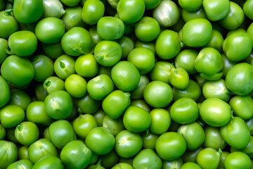 background of fresh, young, peeled green peas