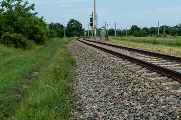 Fototapeta na wymiar a rail road track near the forest