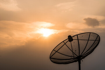 satellite dish on the roof at sunset 