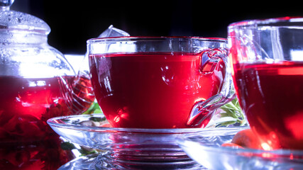 Tea time: cup of tea, carcade, karkade, rooibos. Red hot hibiscus tea in glass mug. Oriental, cozy, ceremony, tradition, japanese, leafy, hygge, autumn, 5 o'clock, afternoon tea