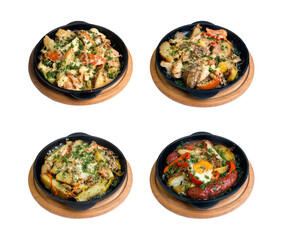 a set of dishes from potatoes on a black frying pan on a white background. isolate