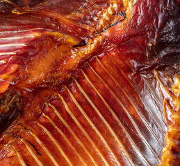 Smoked fish meat and ribs as a background.