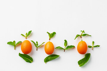 Top view of kumquat fruit on white background