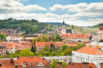 State castle of Cesky Krumlov a the towns red roofs from above