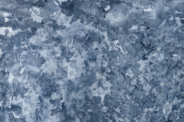 Background with uneven putty and paint. Interesting texture for the background. Uneven smears of putty and paint on the wall.