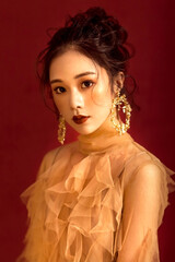 Beautiful sexy Asian girl in red background