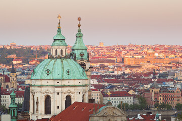 Close up of St. Nicholas church of Lesser town of Prague viewed from Prague castle during twilight