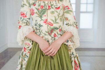 Hands of woman in vintage medieval dress