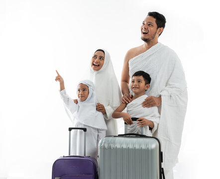 muslim couple presenting copyspace. umrah asian man and woman