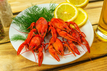 Boiled crayfish boiled ready to eat, wooden background.