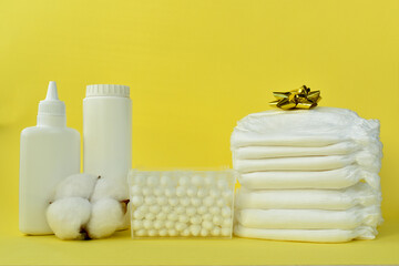 Baby care products on a yellow background.