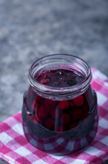 Fototapeta na wymiar Cherry jam for breakfast. Cooking jam in the summer season. Cooking, preserving berries.
