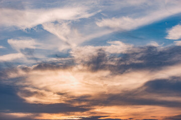 Naklejka na ściany i meble Amazing cloudscape on the sky at sunset time.