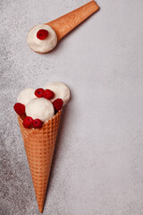 Edible spoons. Raspberry ice cream. Sweet spoons with ice cream.