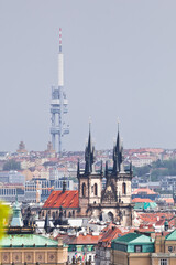 Tyn church of Old town of Prague with Zizkov tower in the background taken from above