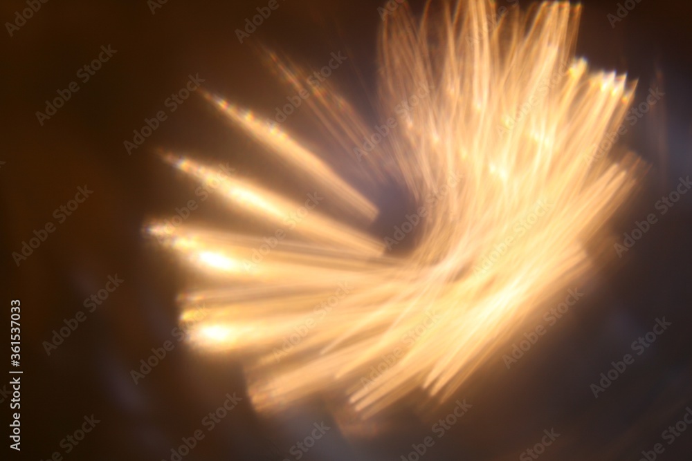Poster abstract background with staggered and refracted golden vortex light effects