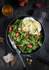 Summer salad with strawberry and soft cheese 