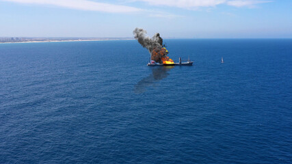 Cargo ship burning on fire with large scale smoke-Aerial
Aerial, Mediterranean Sea, Cargo tanker...