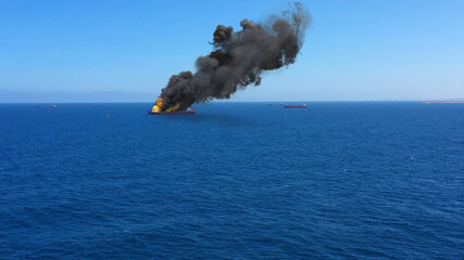 Cargo ship burning on fire with large scale smoke-Aerial
Aerial, Mediterranean Sea, Cargo tanker...