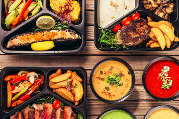 group of food in plastic dish on table. take away food