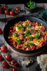 Jewish fried eggs in tomato sauce 